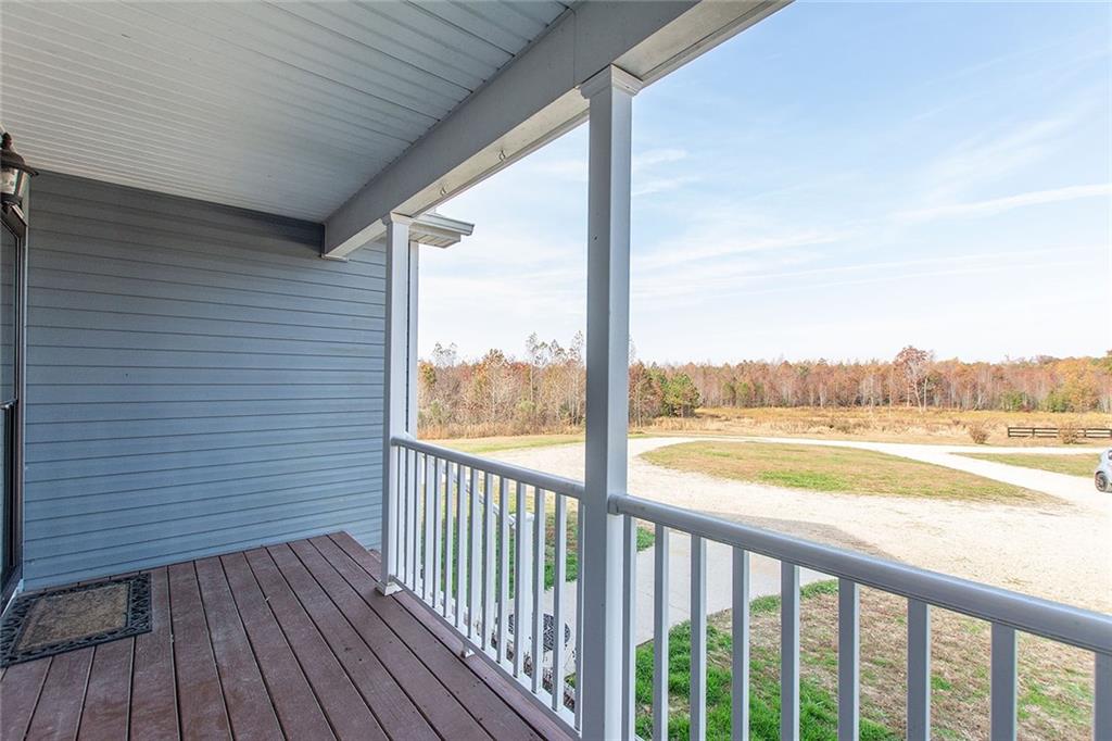 9481 Sturgeon Point Road Charles City, VA 23030 - Photo 6 of 44 a view of a wooden deck and city view