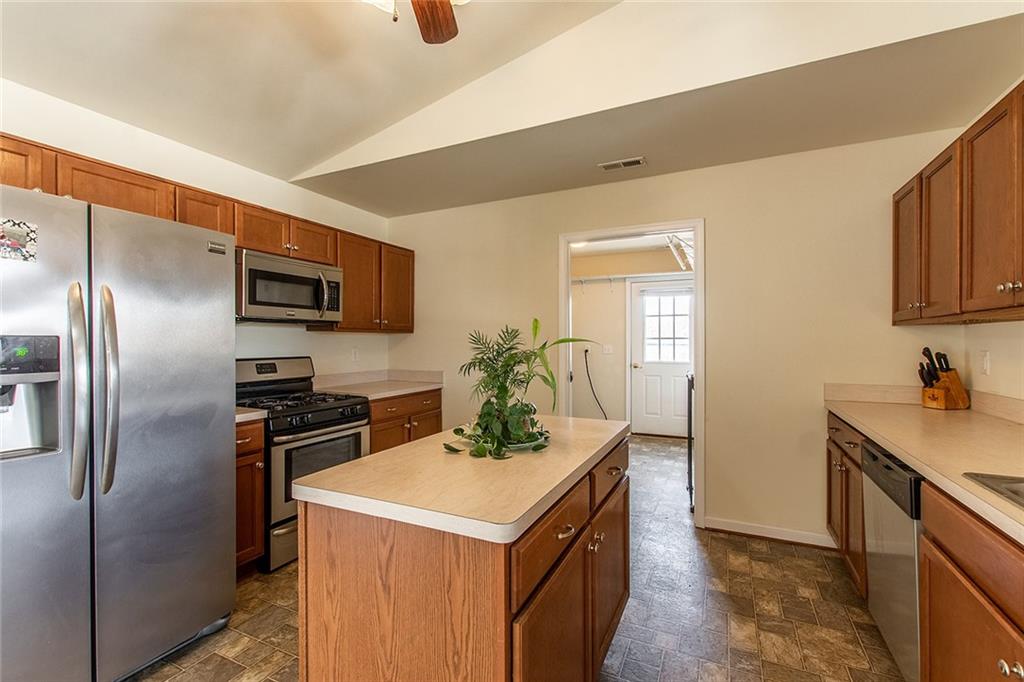 9481 Sturgeon Point Road Charles City, VA 23030 - Photo 8 of 44 a kitchen with a refrigerator sink and stove