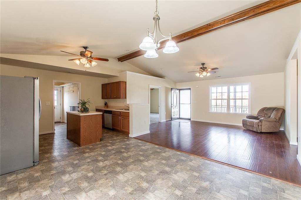 9481 Sturgeon Point Road Charles City, VA 23030 - Photo 9 of 44 a view of a livingroom with furniture a ceiling fan and window