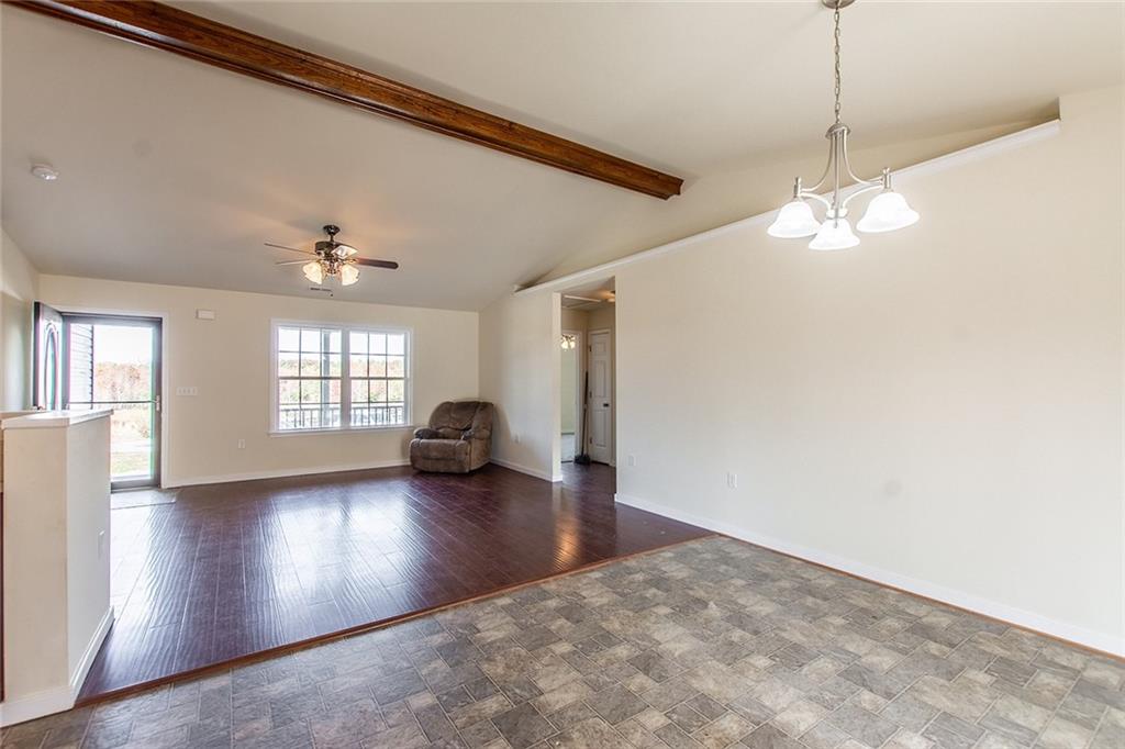 9481 Sturgeon Point Road Charles City, VA 23030 - Photo 10 of 44 a view of empty room with wooden floor and fan