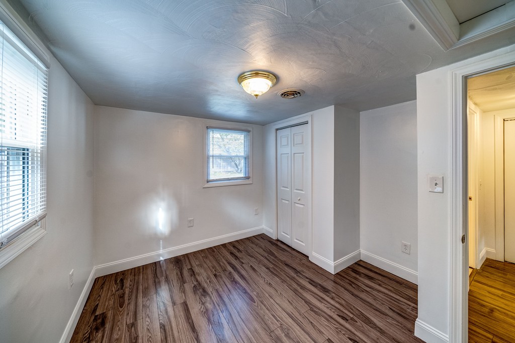 98 David Street Springfield, MA 01104 - Photo 14 of 26 wooden floor in an empty room with a window
