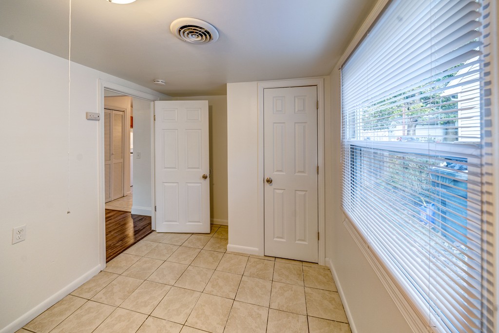 98 David Street Springfield, MA 01104 - Photo 20 of 26 a view of an empty room with wooden floor and a window