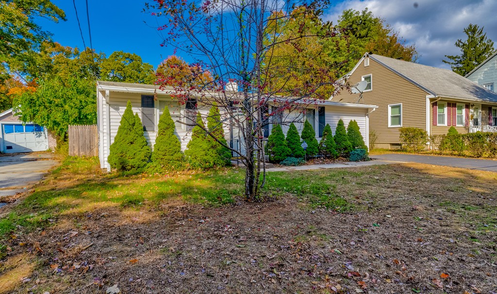 98 David Street Springfield, MA 01104 - Photo 3 of 26 a front view of house with yard and green space