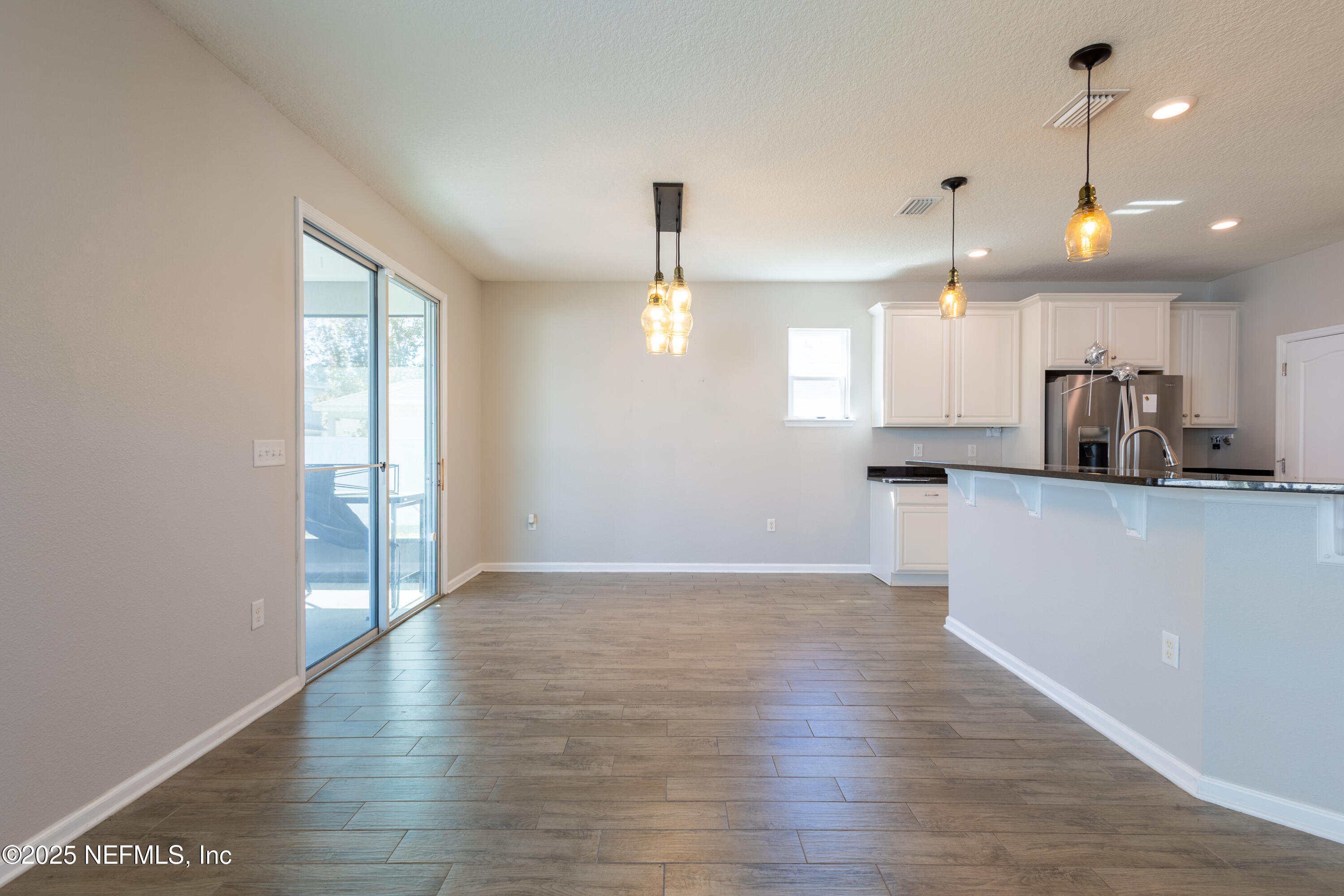 68 Redland Way Jacksonville, FL 32218 - Photo 15 of 40 a view of kitchen with wooden floor and window