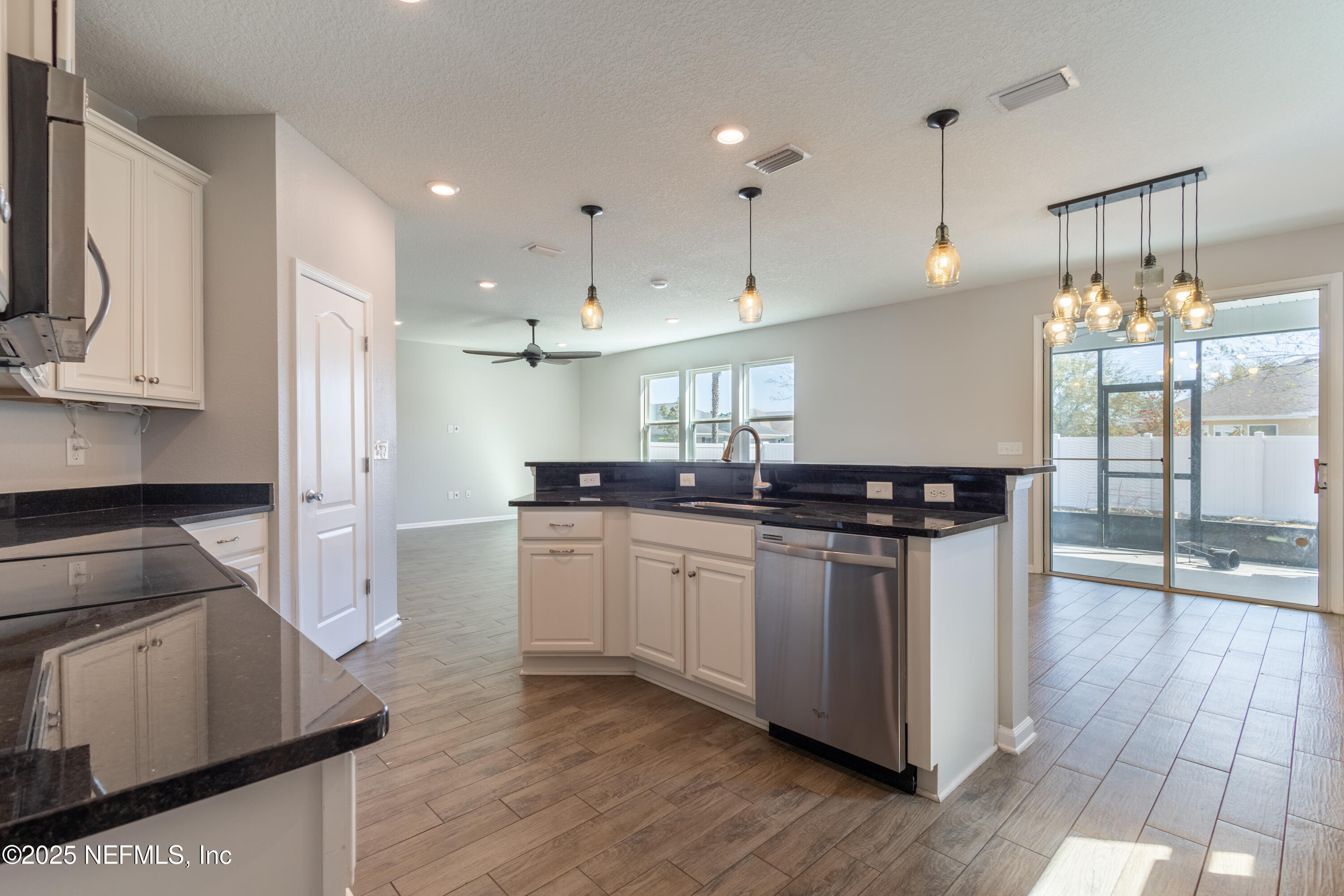 68 Redland Way Jacksonville, FL 32218 - Photo 20 of 40 a kitchen with stainless steel appliances granite countertop a stove a sink and a refrigerator