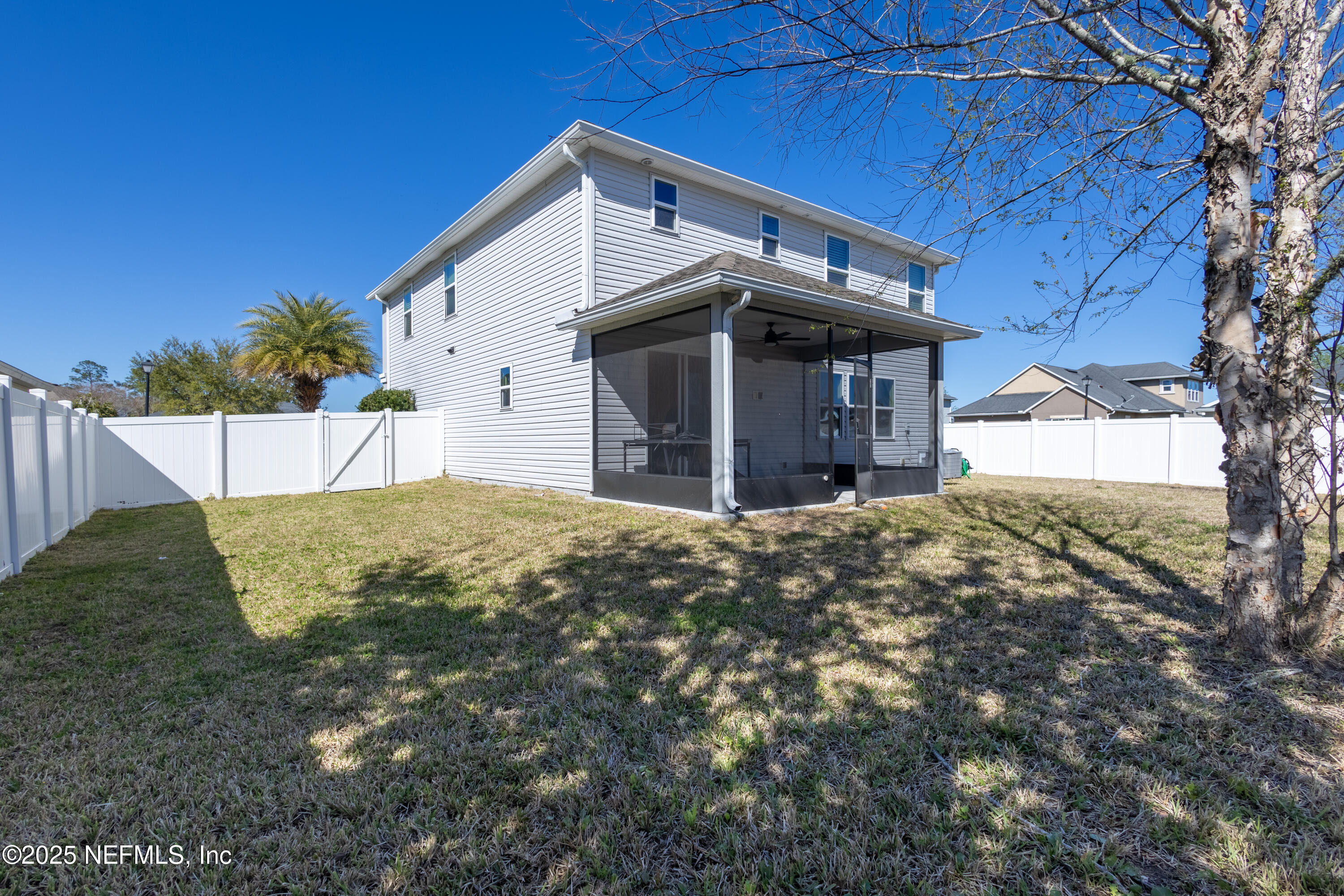 68 Redland Way Jacksonville, FL 32218 - Photo 37 of 40 a view of a house with a yard and garage