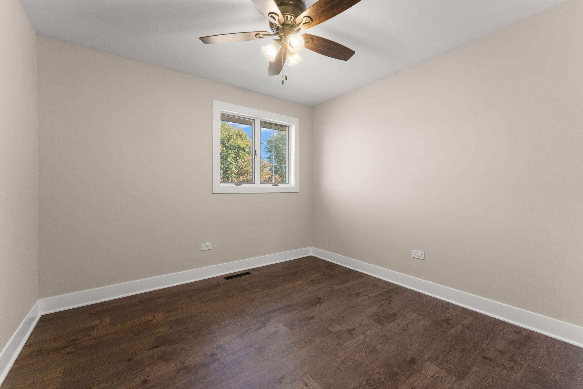 2624 Fossil Stone Road Dyer, IN 46311 - Photo 13 of 30 an empty room with a window and a fan