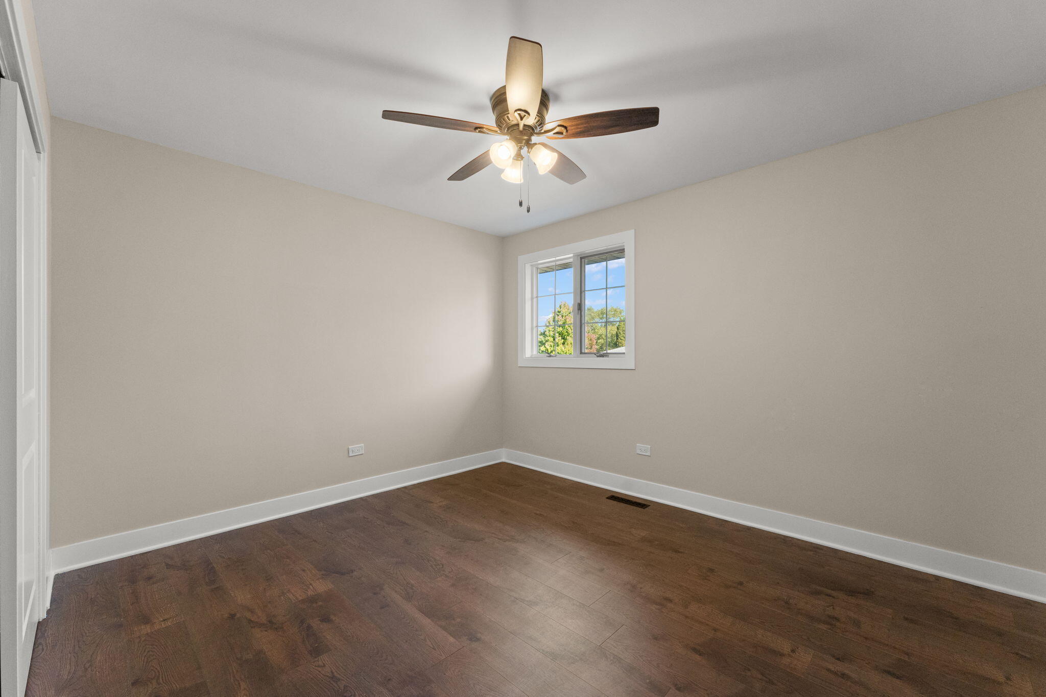 2624 Fossil Stone Road Dyer, IN 46311 - Photo 14 of 30 an empty room with a window and a ceiling fan