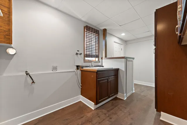 a room with a cabinets and a window