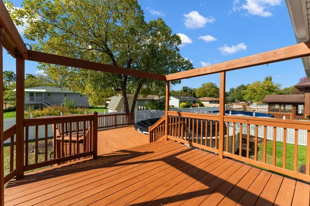 a view of a two chairs in the balcony