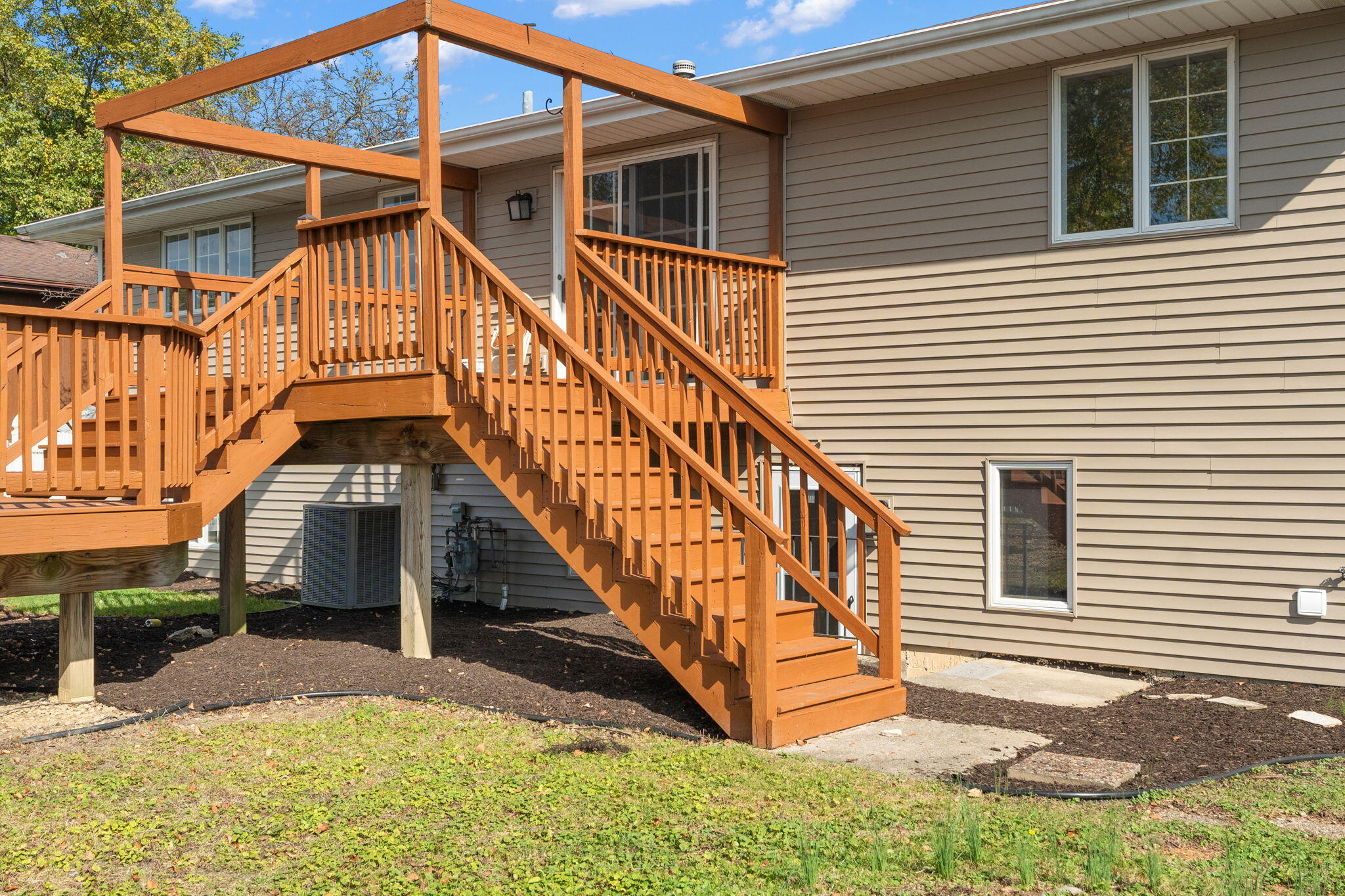 2624 Fossil Stone Road Dyer, IN 46311 - Photo 29 of 30 a view of house with wooden stairs and a small yard