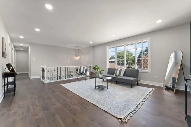 a living room with furniture and a table