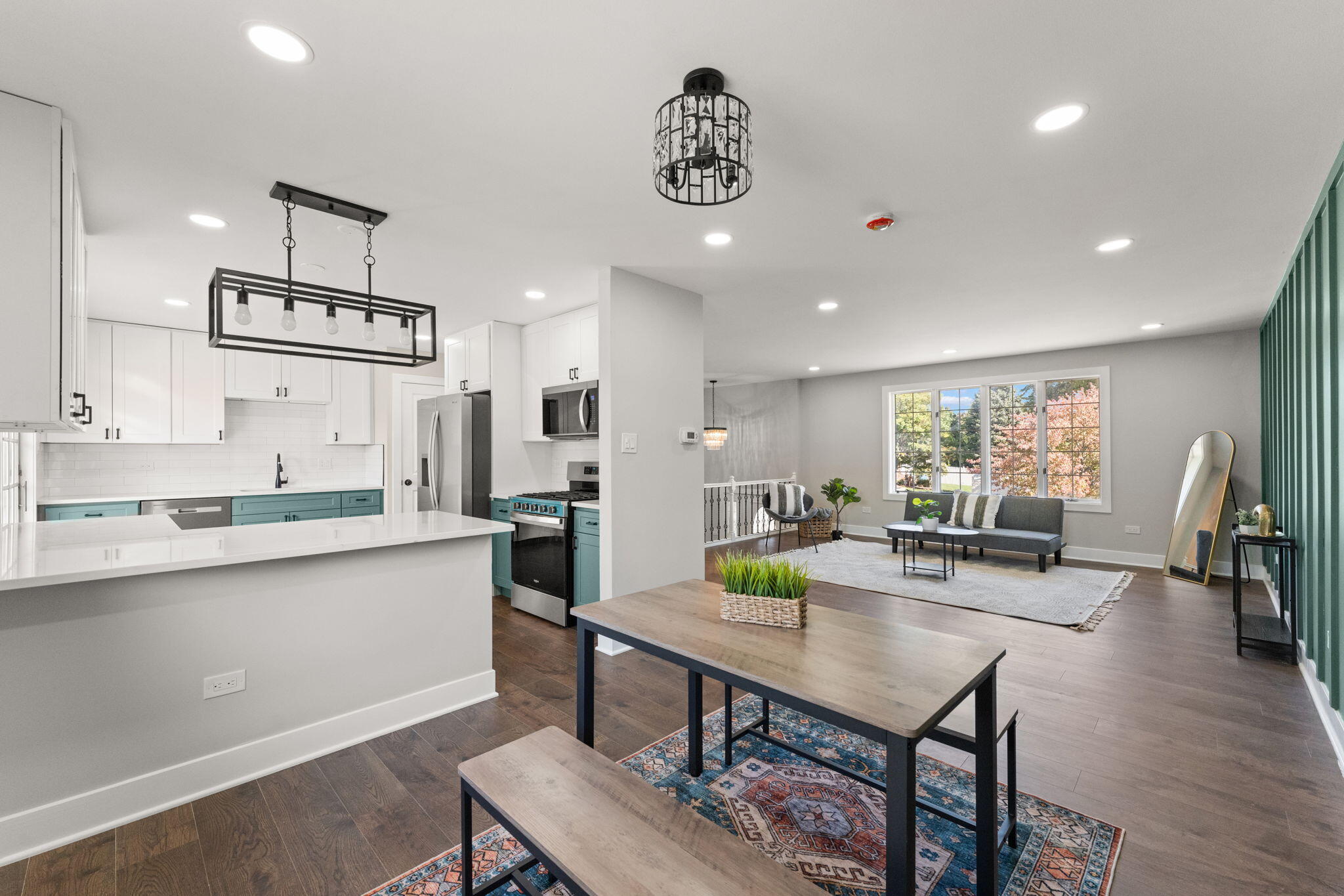 2624 Fossil Stone Road Dyer, IN 46311 - Photo 7 of 30 a kitchen with stainless steel appliances granite countertop a sink counter space and wooden floor