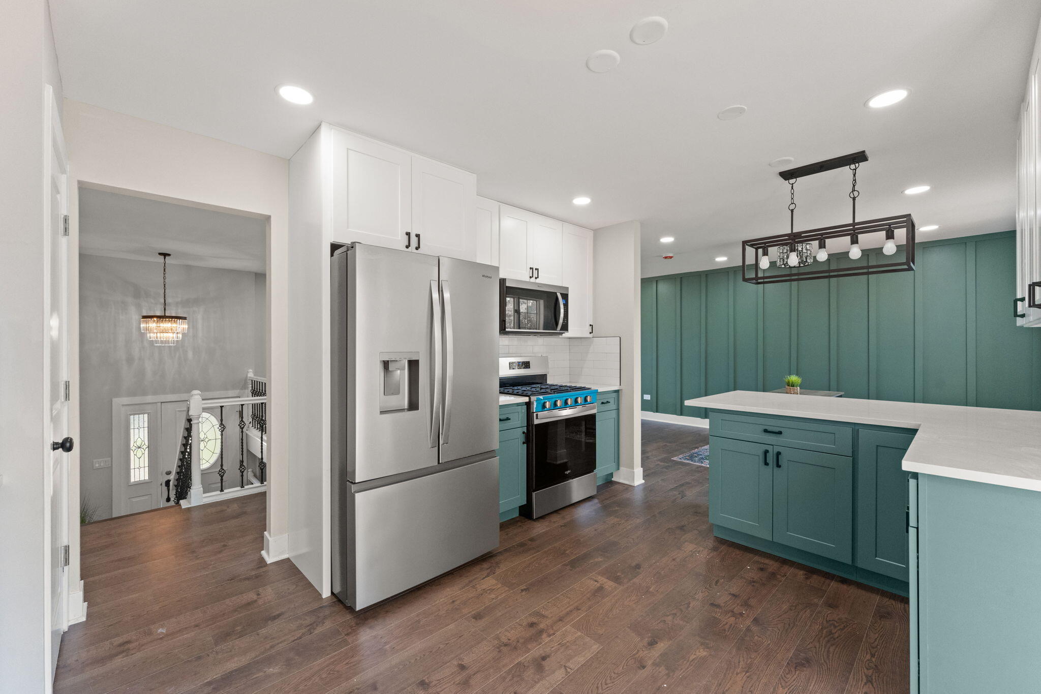 2624 Fossil Stone Road Dyer, IN 46311 - Photo 9 of 30 a kitchen with kitchen island stainless steel appliances a refrigerator a sink a stove a microwave and island