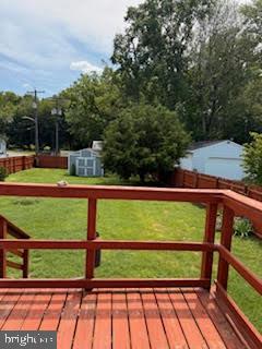 7361 Chesapeake Road Baltimore, MD 21220 - Photo 12 of 21 a view of a yard with wooden fence