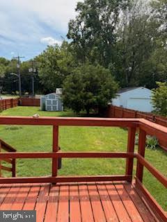7361 Chesapeake Road Baltimore, MD 21220 - Photo 13 of 21 a view of a yard with wooden fence