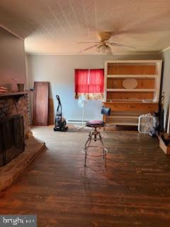 7361 Chesapeake Road Baltimore, MD 21220 - Photo 9 of 21 a living room with furniture a flat screen tv and a fireplace