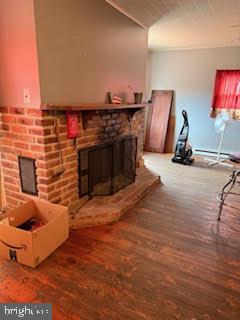 7361 Chesapeake Road Baltimore, MD 21220 - Photo 10 of 21 a living room with furniture a flat screen tv and a fireplace