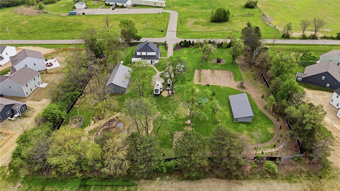 6155 North Union Road Clayton, OH 45315 - Photo 7 of 59 This verdant aerial perspective reveals a charming property with ample green space.