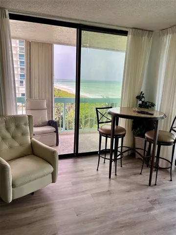 a view of a livingroom with furniture and a table