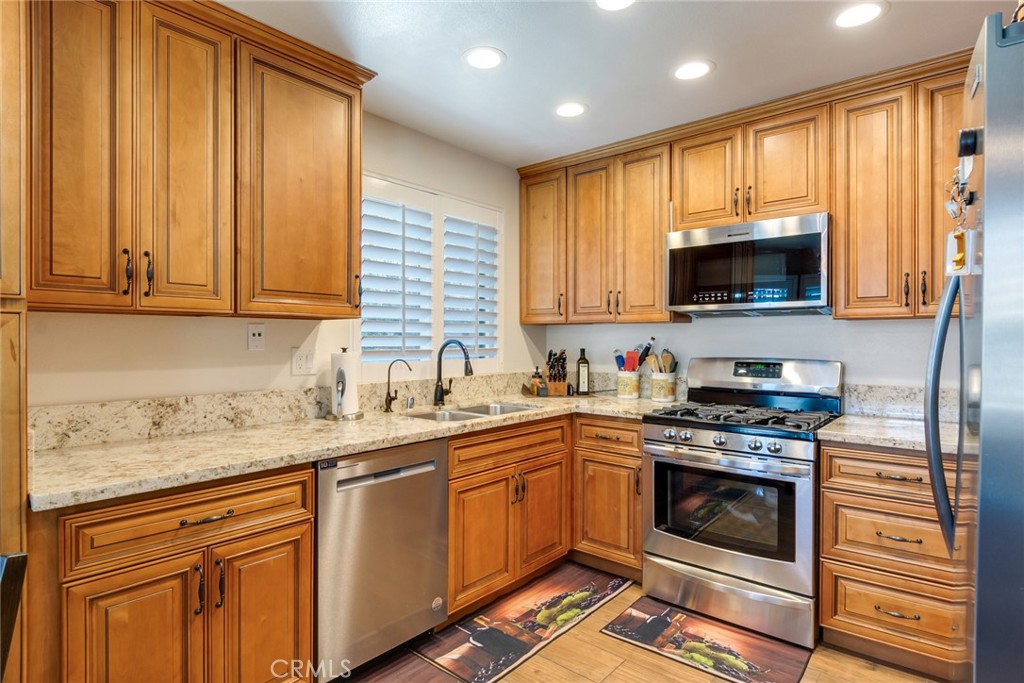 3198 Bexfield Court Riverside, CA 92503 - Photo 15 of 33 Kitchen with Custon Cabinets and Stainless Steel Appliances