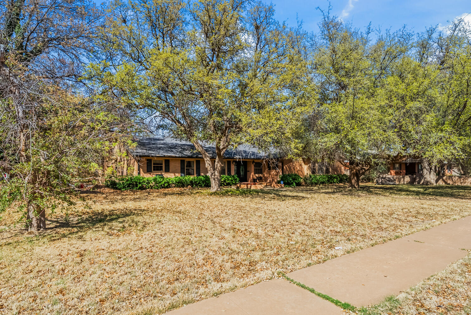 4706 18th Street Lubbock, TX 79416 - Photo 1 of 1 a front view of a house with a yard
