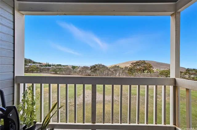 a view of balcony with furniture and city view