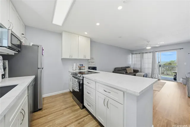 a kitchen with a sink a stove and refrigerator
