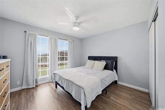 a bedroom with a large bed and a window