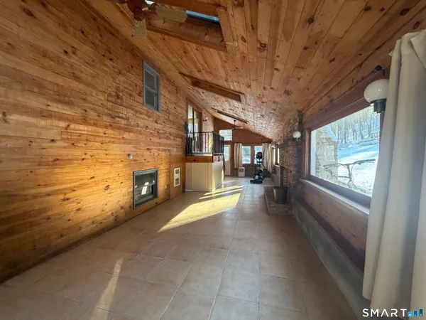a view of an empty room with a fireplace