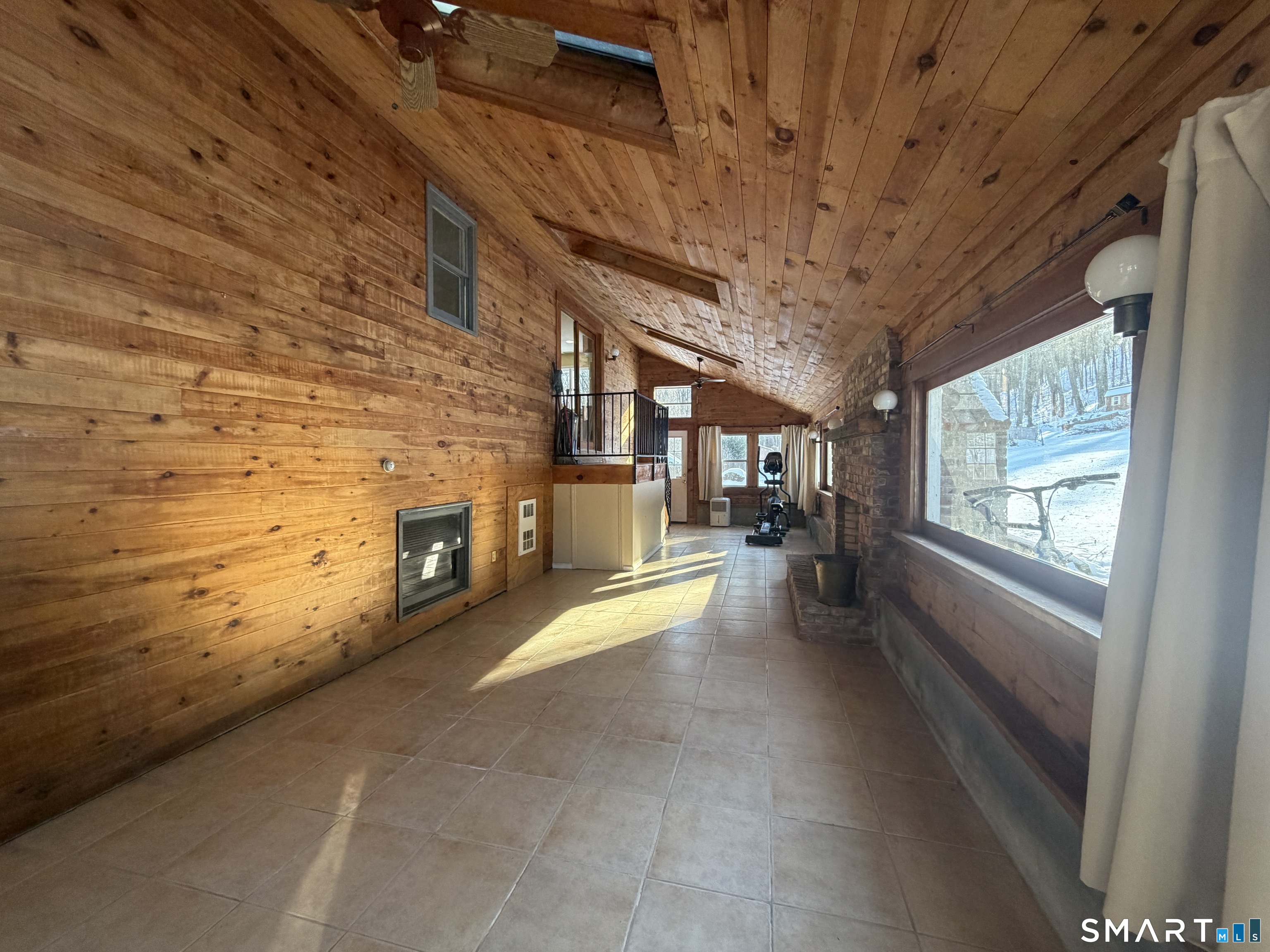 a view of an empty room with a fireplace