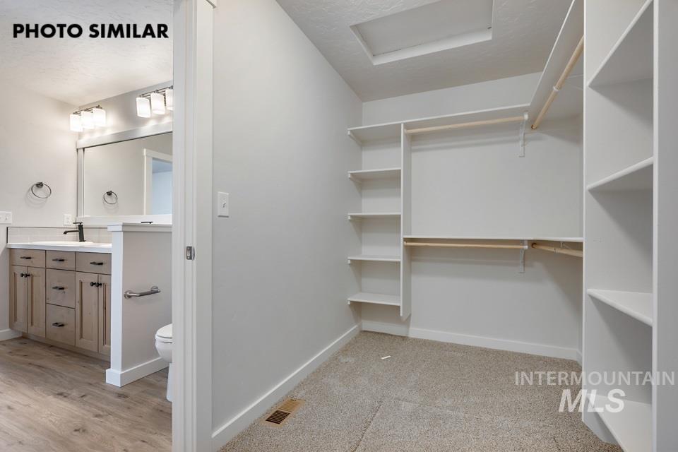 1644 Haystack Emmett, ID 83617 - Photo 16 of 33 Walk-in closet featuring extensive built-in shelving and hanging rods