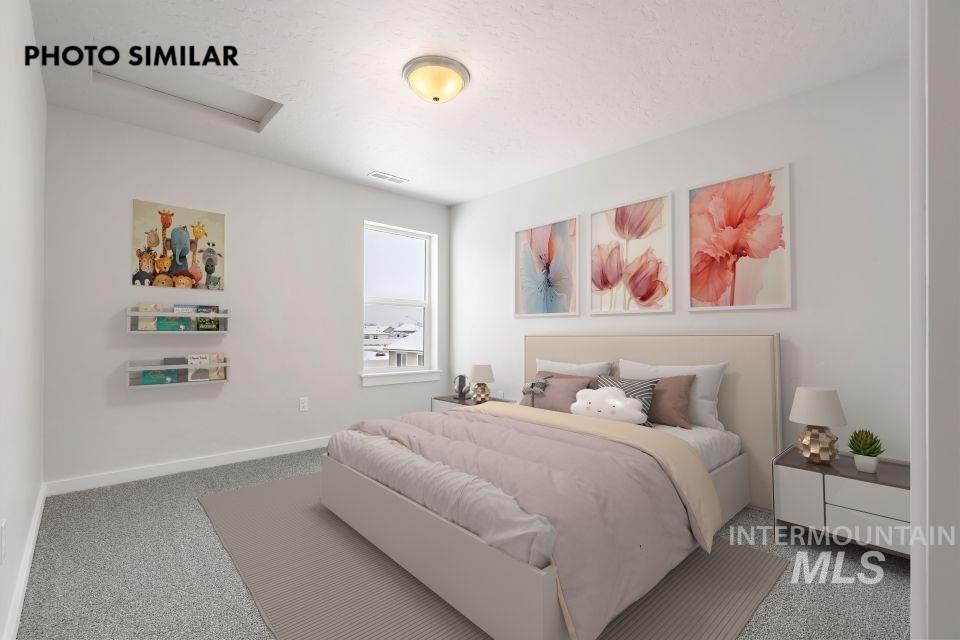 1644 Haystack Emmett, ID 83617 - Photo 23 of 33 Light-filled room featuring a single window with white trim, a flush-mount ceiling light fixture, and textured carpeting