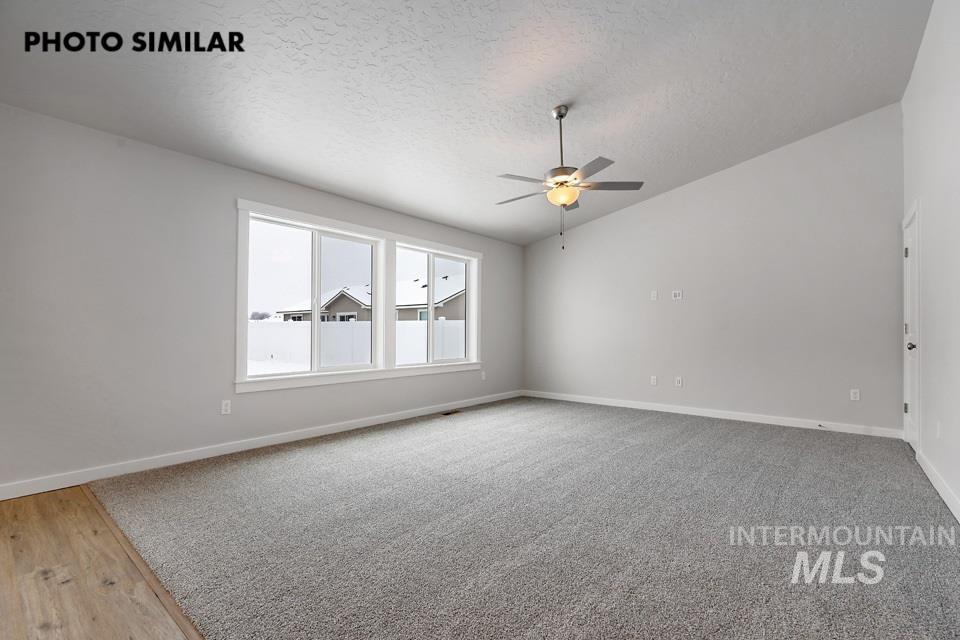 1644 Haystack Emmett, ID 83617 - Photo 4 of 33 Spacious room featuring vaulted ceilings, recessed lighting, and a contemporary ceiling fan