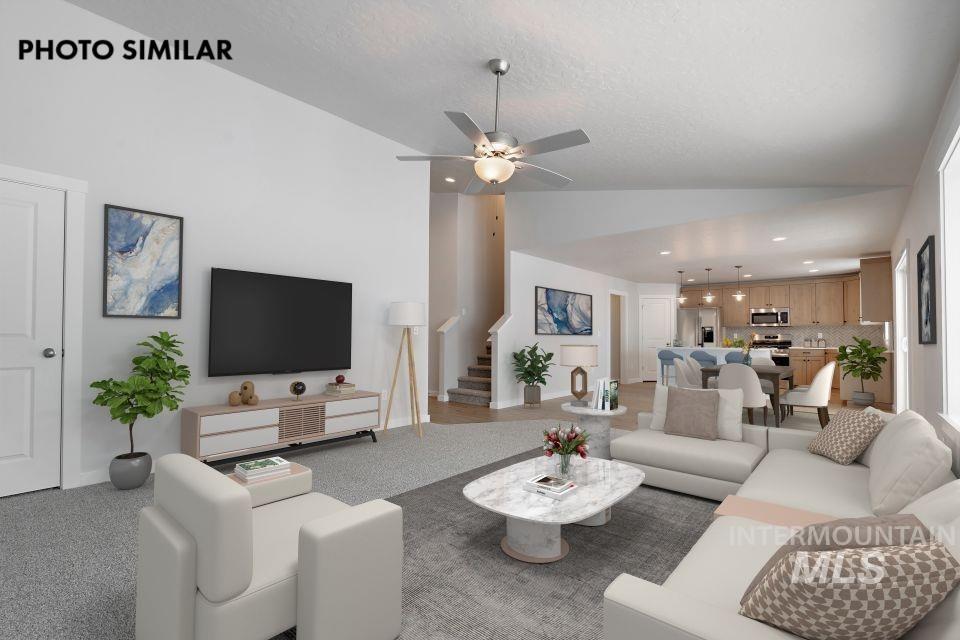 1644 Haystack Emmett, ID 83617 - Photo 6 of 33 Open-concept living space featuring a ceiling fan, light-colored walls, and carpeting