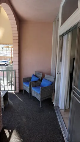 a view of bedroom with furniture and a window