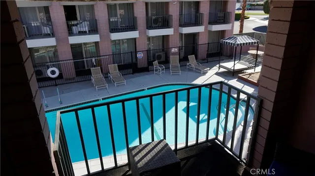 a balcony view with couple of chairs