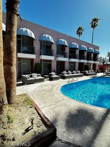 a view of a building with cars park