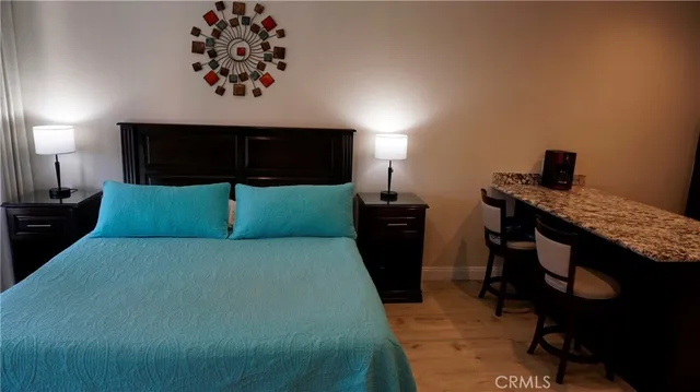 a bedroom with a bed and a television