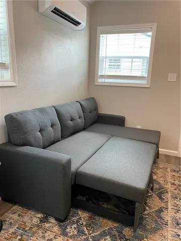 a living room with furniture and a window