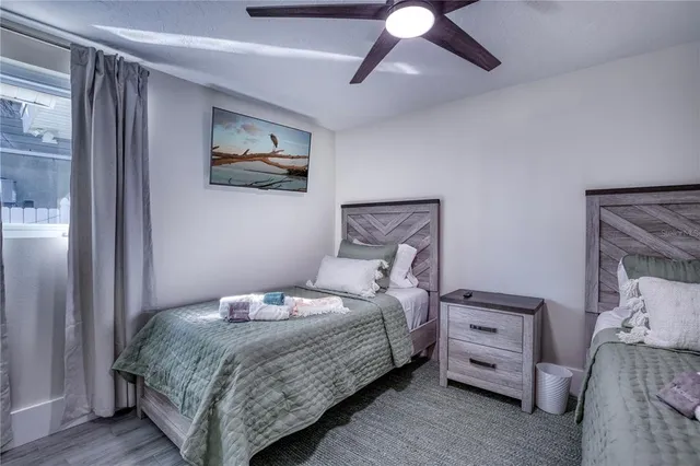 a bedroom with a bed and lamp