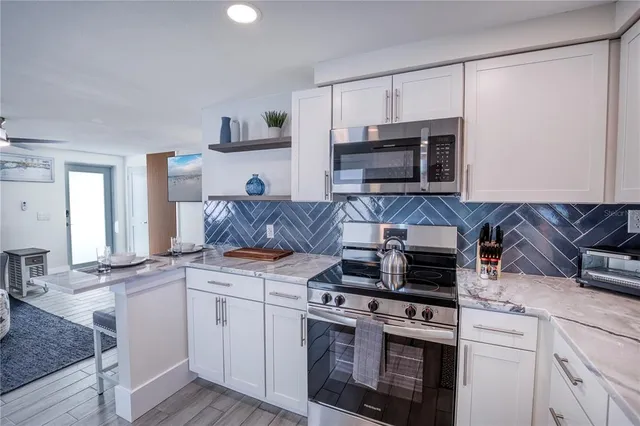 a kitchen with a stove and a microwave