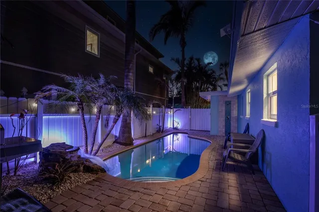 a view of a backyard with sitting area