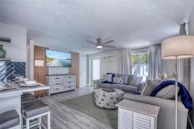 a view of a room with wooden walls and window