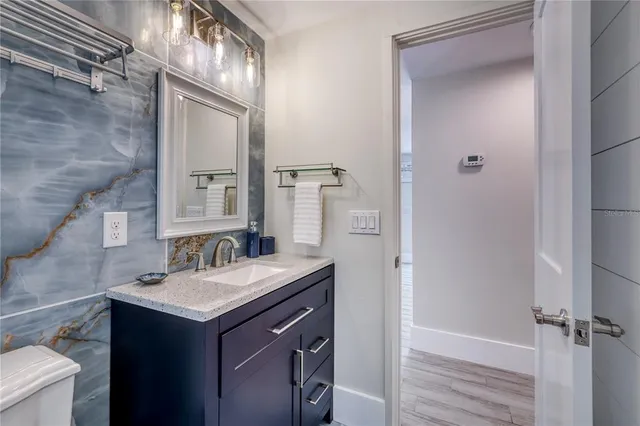 a living room with furniture chess board and a window