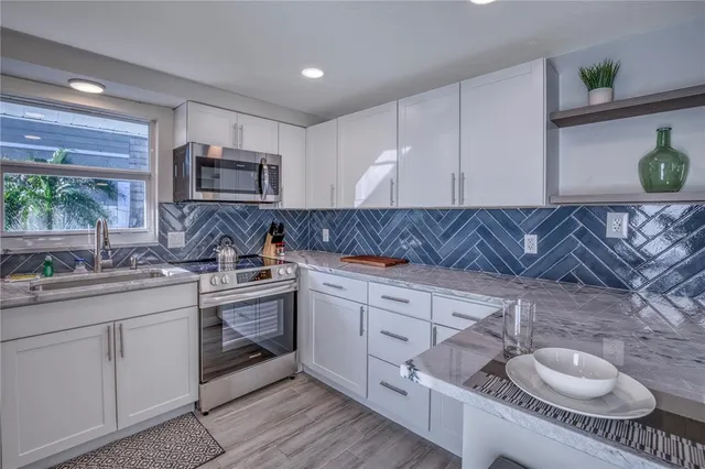 a wooden bench sitting in front of a building
