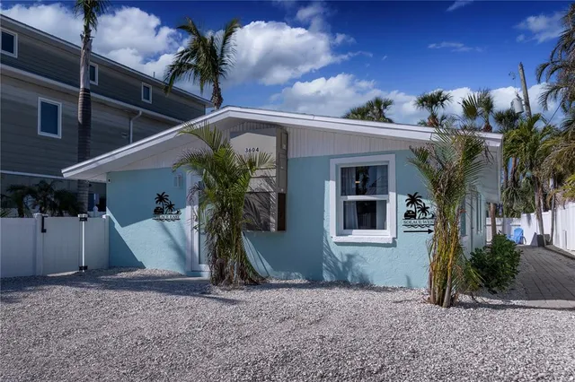 a view of a house with a tree