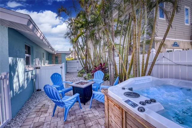 a view of a chairs and table in the patio
