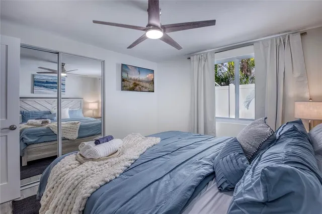 a bedroom with a large bed and a window