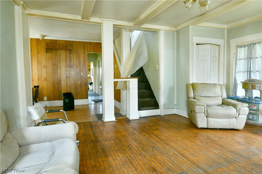 5013 King-Graves Road Vienna, OH 44473 - Photo 25 of 50 Living room featuring hardwood / wood-style flooring and wood walls